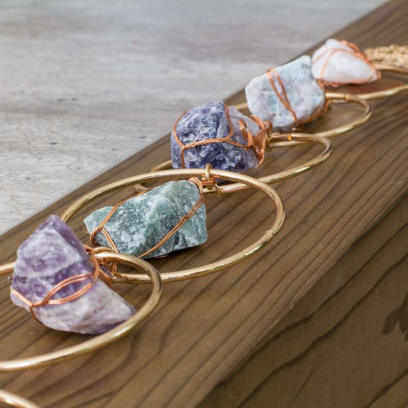 Rough natural stone, wire wrapped, iron ring wall art