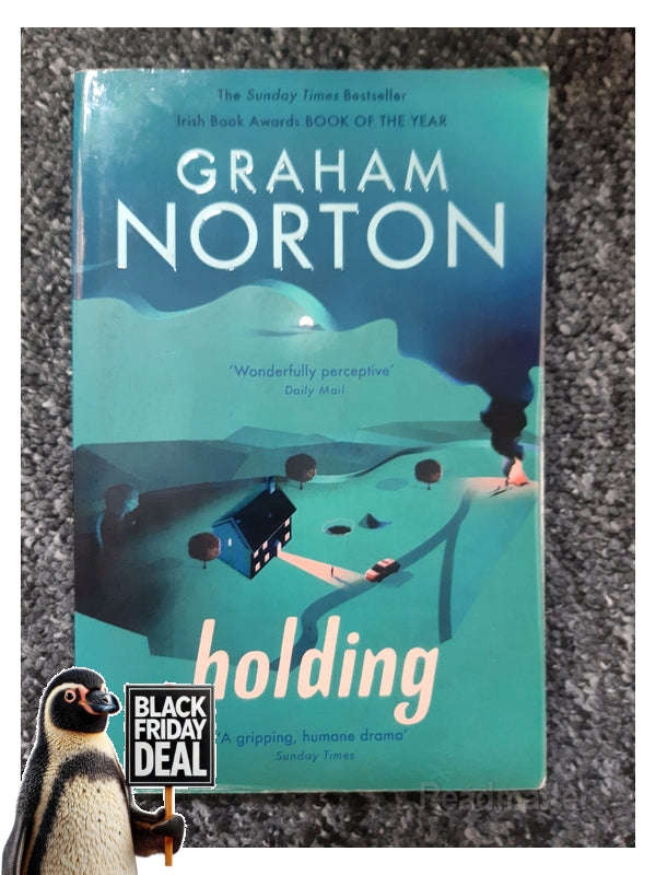 Holding Norton Graham