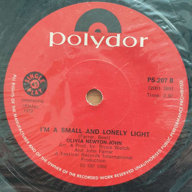 Olivia Newton-John  What Is Life - Vinyl 7" Record - Very-Good+ Quality (VG+) (verygoodplus7)
