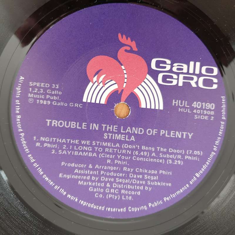 Stimela  Trouble In The Land Of The Plenty - Vinyl LP Record - Very-Good Quality (VG)  (verry)