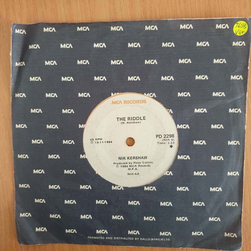 Nik Kershaw  The Riddle - 7" Record - Very-Good+ Quality (VG+) (verygoodplus7) (DLB)