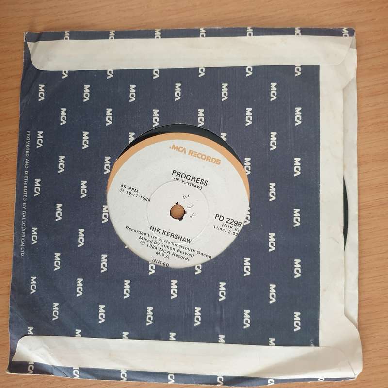 Nik Kershaw  The Riddle - 7" Record - Very-Good+ Quality (VG+) (verygoodplus7) (DLB)