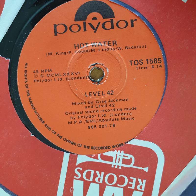 Level 42  Lessons In Love - 7" Vinyl Record  (VG+) (DLB)
