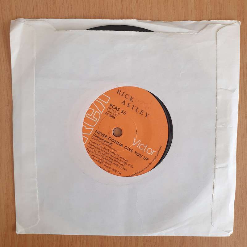 Rick Astley  Never Gonna Give You Up - 7" Vinyl Record  (VG+) (DLB)