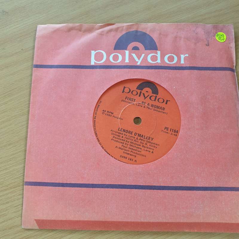 Lenore O'Malley  First... Be A Woman  - Vinyl 7" Record (VG+)