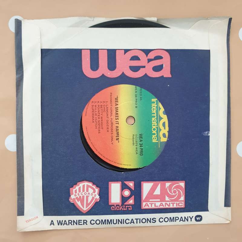 WEA Makes It Happen - Vinyl 7" Record - Very-Good+ Quality (VG+)