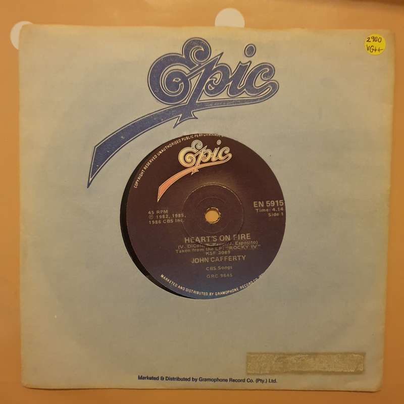 John Cafferty  Heart's On Fire - Vinyl 7" Record - Very-Good+ Quality (VG+)