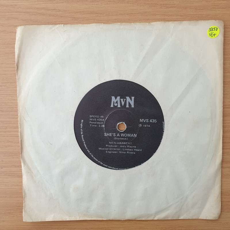 Neil Herbert  She's A Woman - Vinyl 7" Record - Very-Good+ Quality (VG+) (verygoodplus)