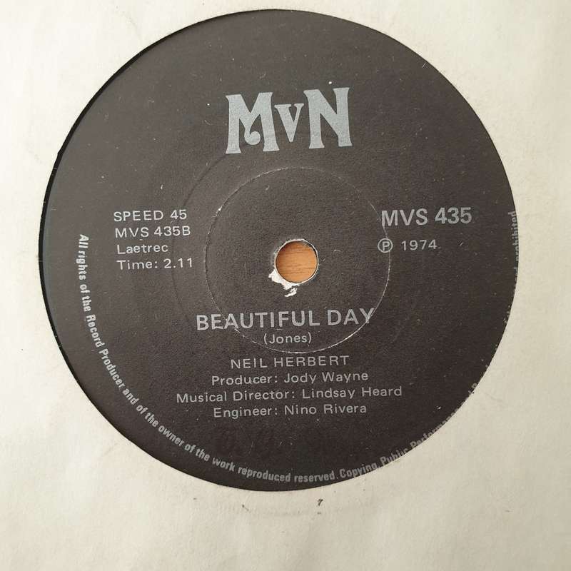 Neil Herbert  She's A Woman - Vinyl 7" Record - Very-Good+ Quality (VG+) (verygoodplus)
