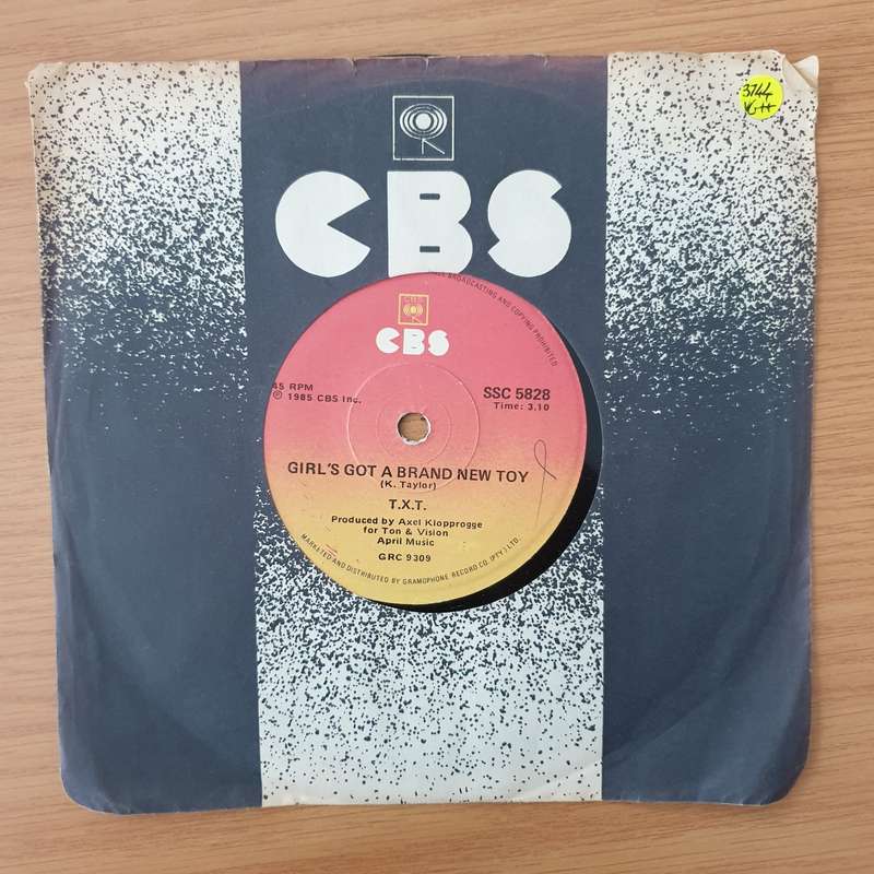 T.X.T.  Girl's Got A Brand New Toy - Vinyl 7" Record - Very-Good+ Quality (VG+) (verygoodplus)