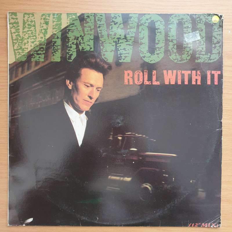 Steve Winwood  Roll With It -  Vinyl LP Record - Very-Good+ Quality (VG+)