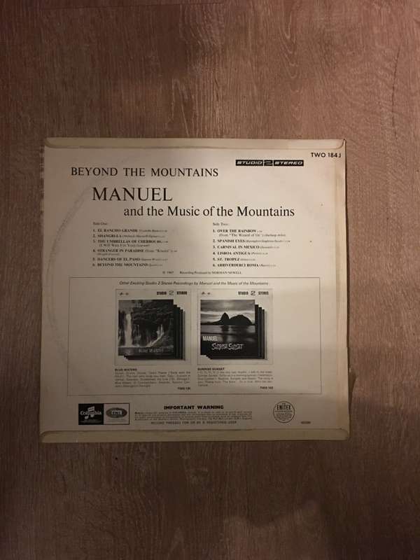 Manuel - Beyond The Mountains - Vinyl LP Record  - Opened  - Very-Good+ Quality (VG+)