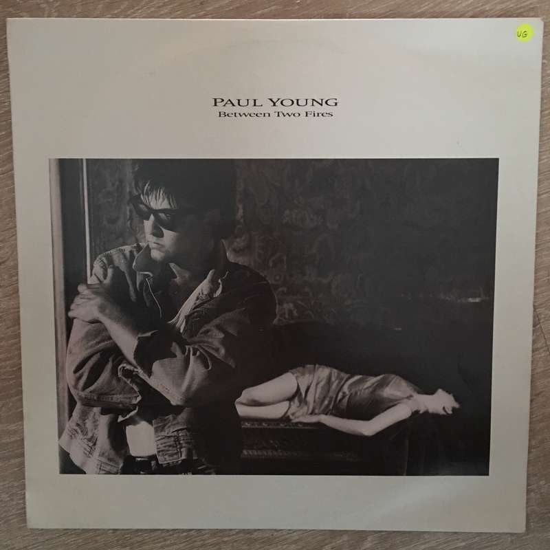 Paul Young - Between Two Fires - Vinyl Record - Opened  - Very-Good Quality (VG)