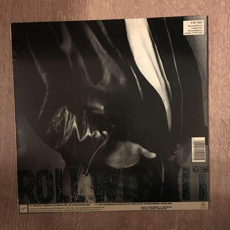 Steve Winwood  Roll With It - Vinyl Record - Opened  - Very-Good Quality (VG)