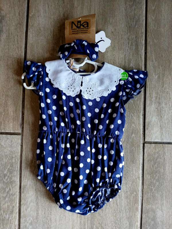 Navy and white polka dot romper