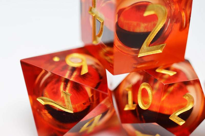 Sharp Edge Moving Eye RPG Dice Set (7) Amber Cyclops (Dice Sets & Games)