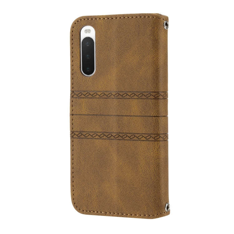 For Sony Xperia 10 IV Embossed Striped Magnetic Buckle Horizontal Flip Phone Leather Case(Brown)