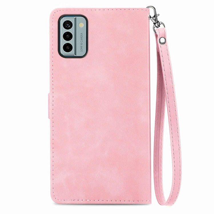 For Nokia G22 Embossed Flower Zipper Leather Phone Case(Pink)