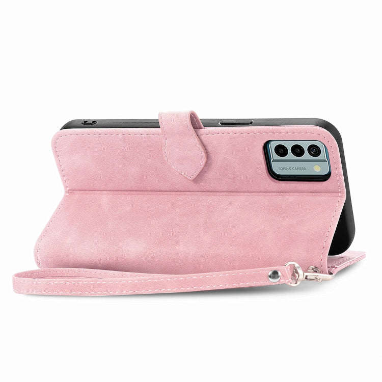 For Nokia G22 Embossed Flower Zipper Leather Phone Case(Pink)