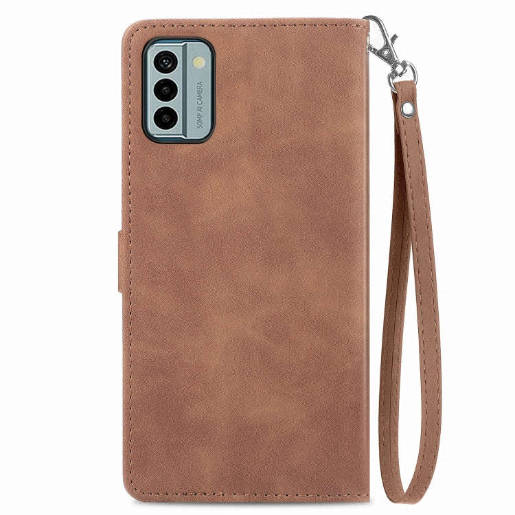 For Nokia G22 Embossed Flower Zipper Leather Phone Case(Brown)
