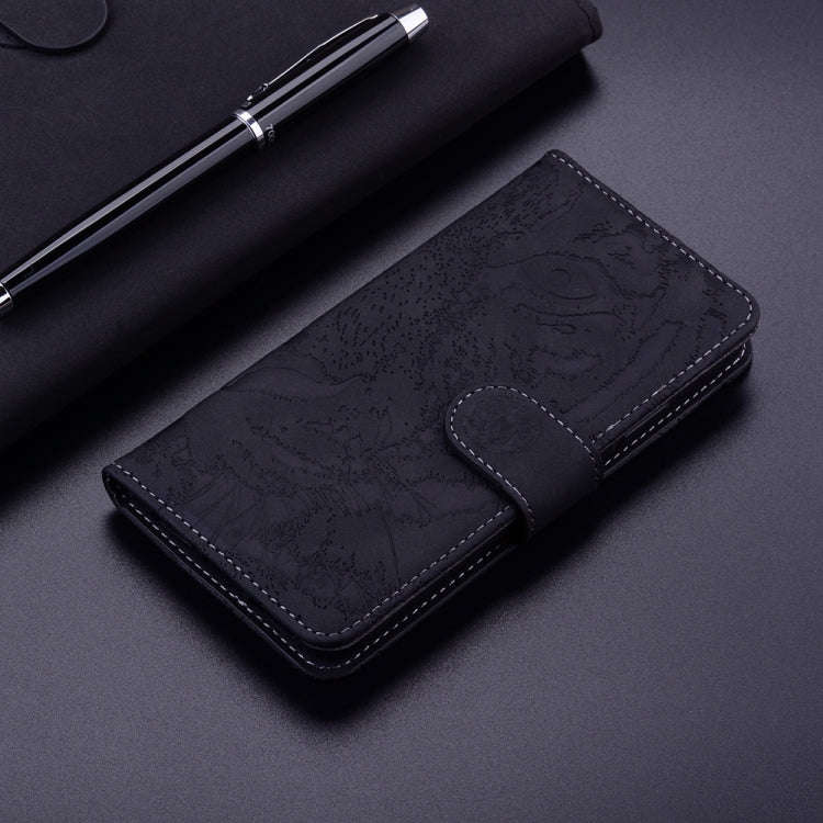 For Motorola Moto G04s / Moto E14 Tiger Embossing Pattern Leather Phone Case(Black)