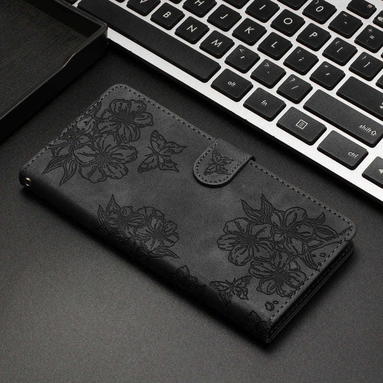 For Motorola Edge 50 Pro Cherry Blossom Butterfly Skin Feel Embossed PU Phone Case(Black)