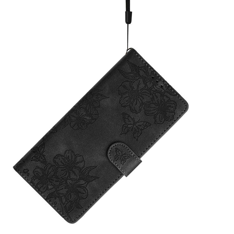 For Motorola Edge 50 Pro Cherry Blossom Butterfly Skin Feel Embossed PU Phone Case(Black)
