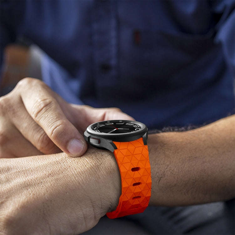 For Samsung Galaxy Watch 6 / 6 Classic Football Pattern Reverse Buckle Silicone Watch Band(Orange)
