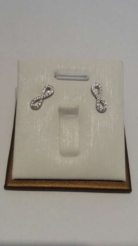 Silver and cubic zirconia infinity stud earrings