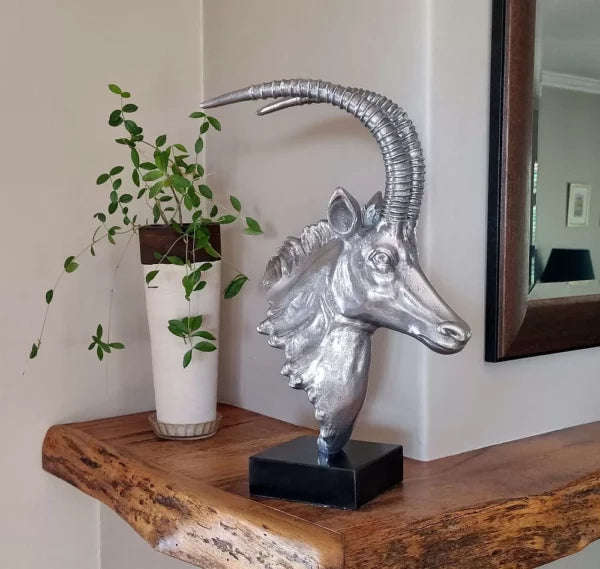 Sable Head sculpture on marble base