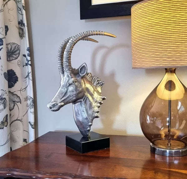 Sable Head sculpture on marble base