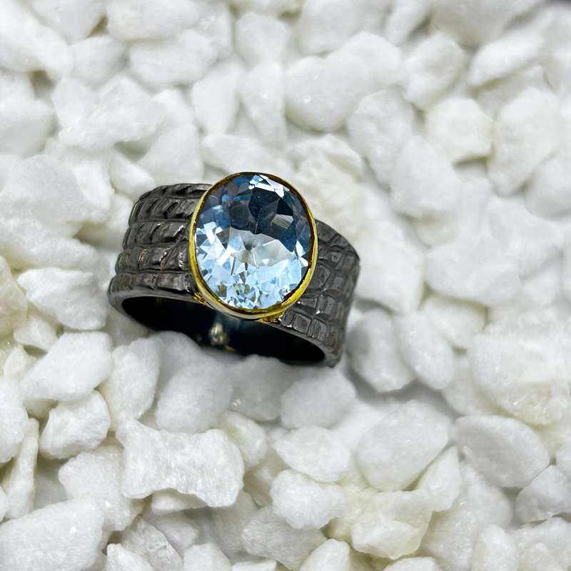Blue Topaz Rhodium Plated Sterling Silver Ring