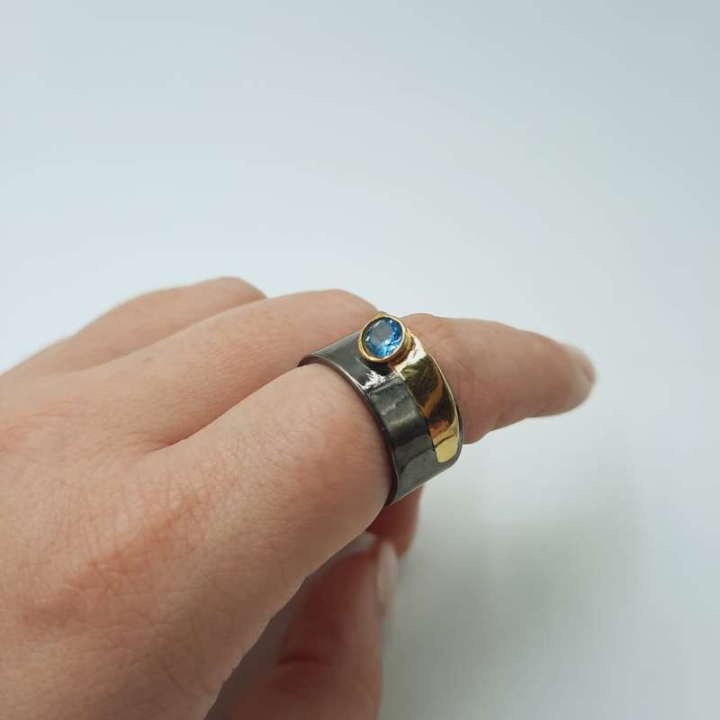 London Blue Topaz Balancing Rhodium Plated Sterling Silver Ring