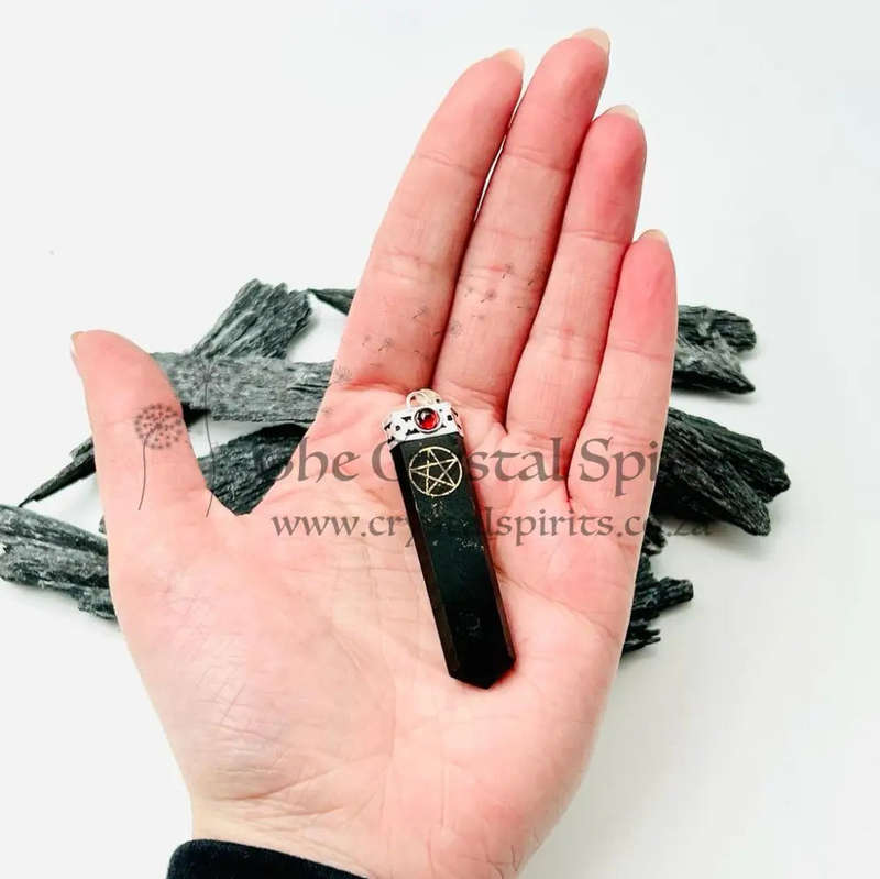 Black Tourmaline Pentacle Pendant Encased In White Metal With A Garnet Cabochon
