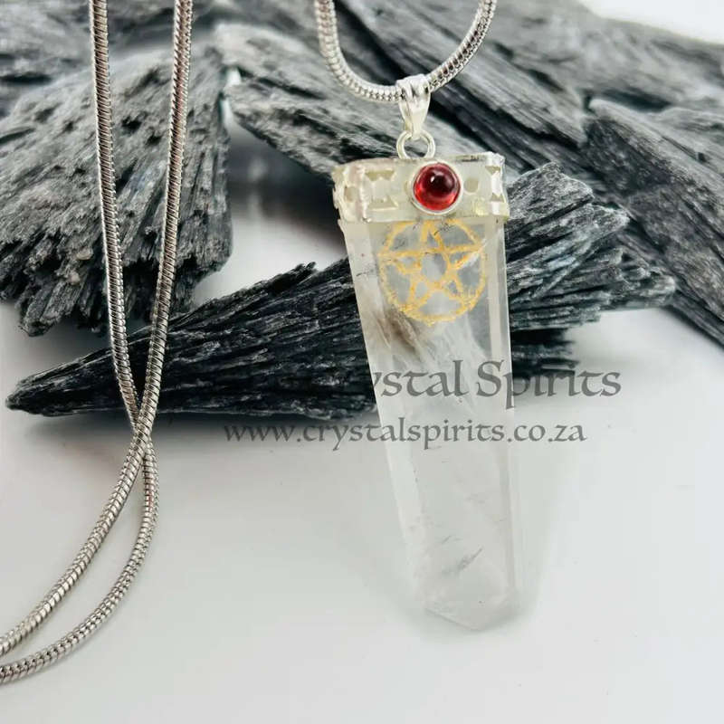 Quartz Pentacle Pendant Encased In White Metal With A Garnet Cabochon