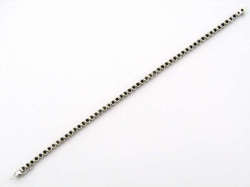 18K gold diamond tennis bracelet.