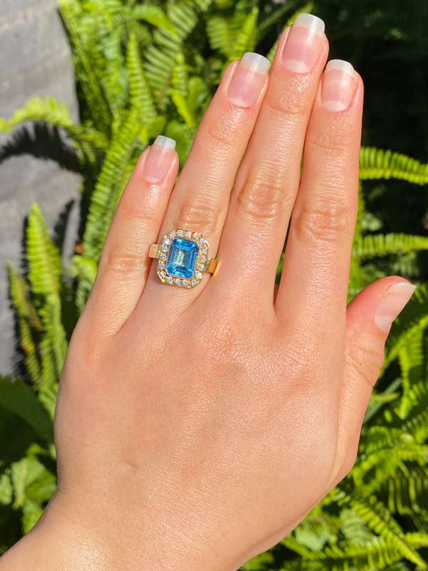 18K gold blue topaz and diamond ring.