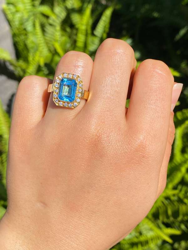 18K gold blue topaz and diamond ring.
