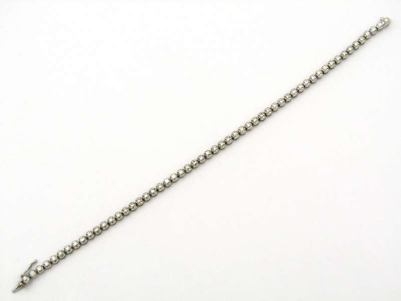 18K gold diamond tennis bracelet.