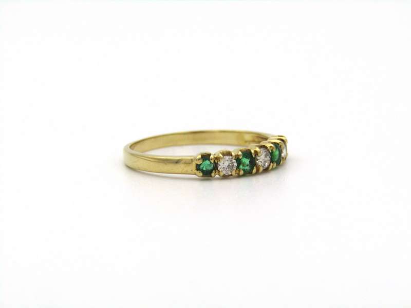 18K gold emerald and diamond ring.