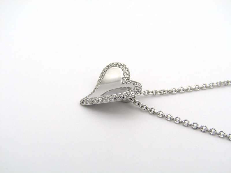 18K gold diamond heart pendant.