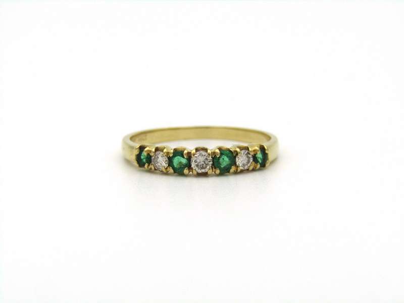 18K gold emerald and diamond ring.