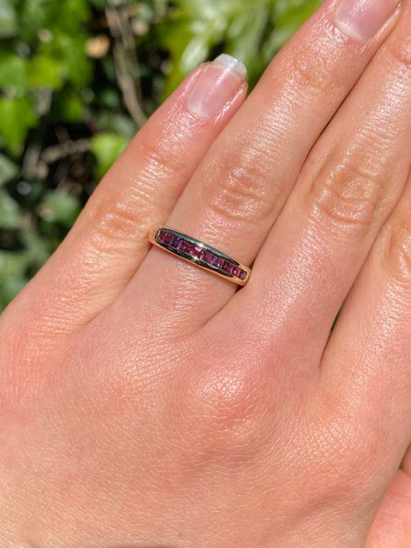 9K gold rhodolite garnet half eternity ring.