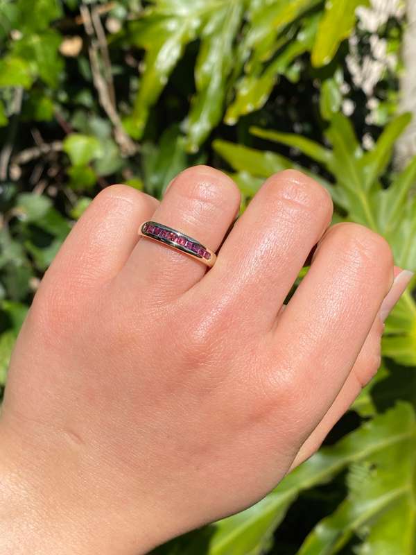 9K gold rhodolite garnet half eternity ring.