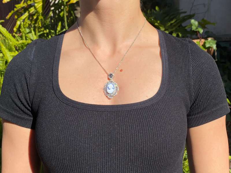 18K gold agate cameo, blue topaz and diamond pendant.