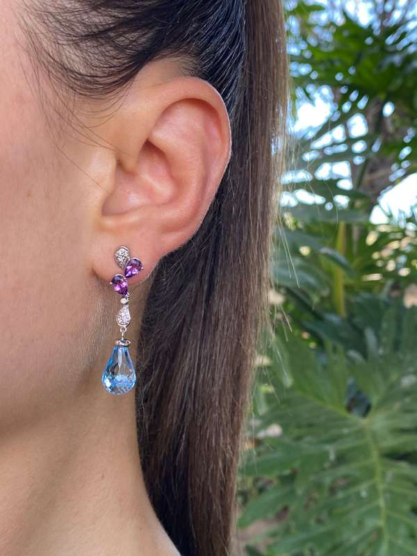 18K gold blue topaz, amethyst, and diamond earrings.