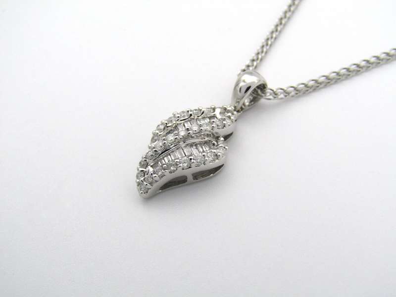 14K gold diamond pendant.