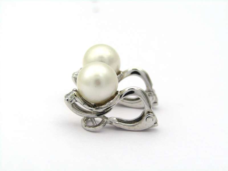 18K gold cultured pearl and diamond earrings.