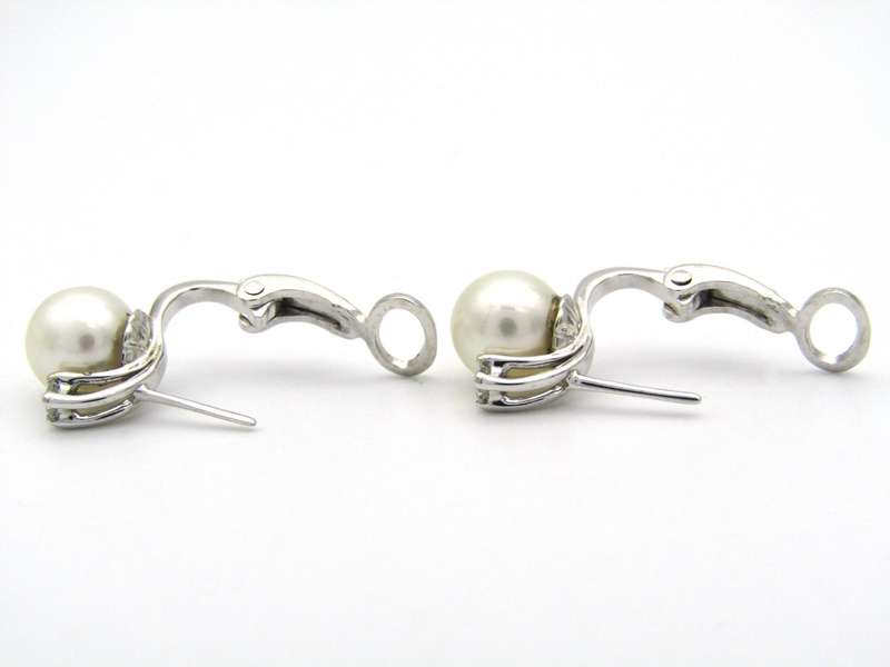 18K gold cultured pearl and diamond earrings.
