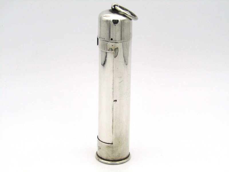 Sterling silver thermometer with swivelling case.